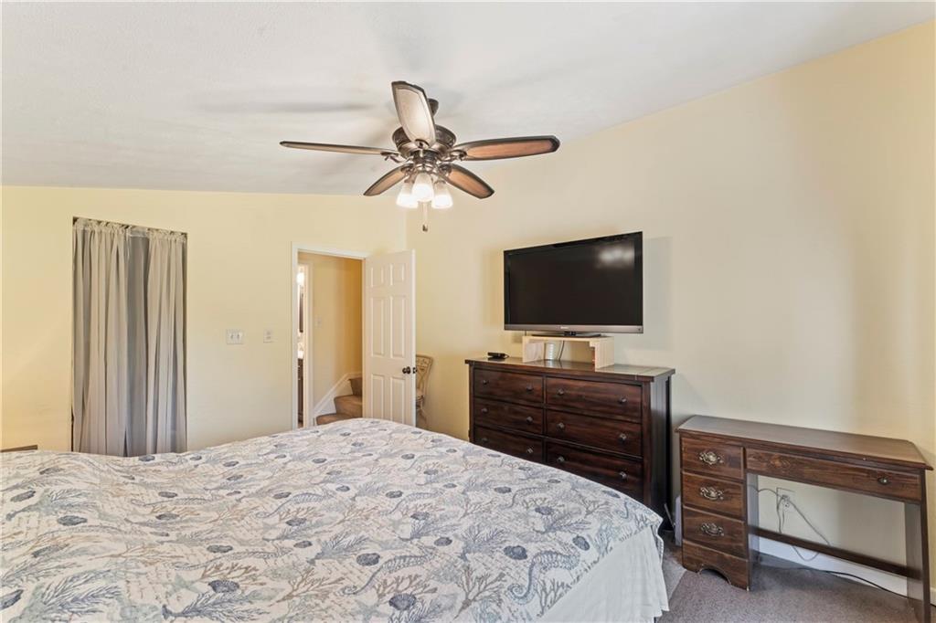 19 Ellen Drive McKees Rocks, PA 15136 - Photo 14 of 38 a bedroom with a bed and a flat screen tv