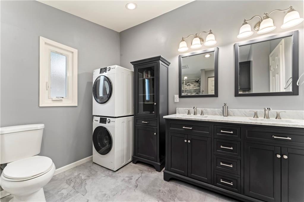 19 Ellen Drive McKees Rocks, PA 15136 - Photo 16 of 38 a spacious bathroom with a toilet sink and mirror