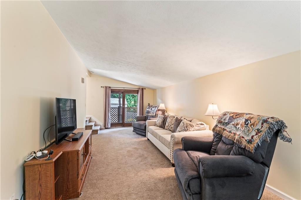 19 Ellen Drive McKees Rocks, PA 15136 - Photo 3 of 38 a living room with furniture and a flat screen tv
