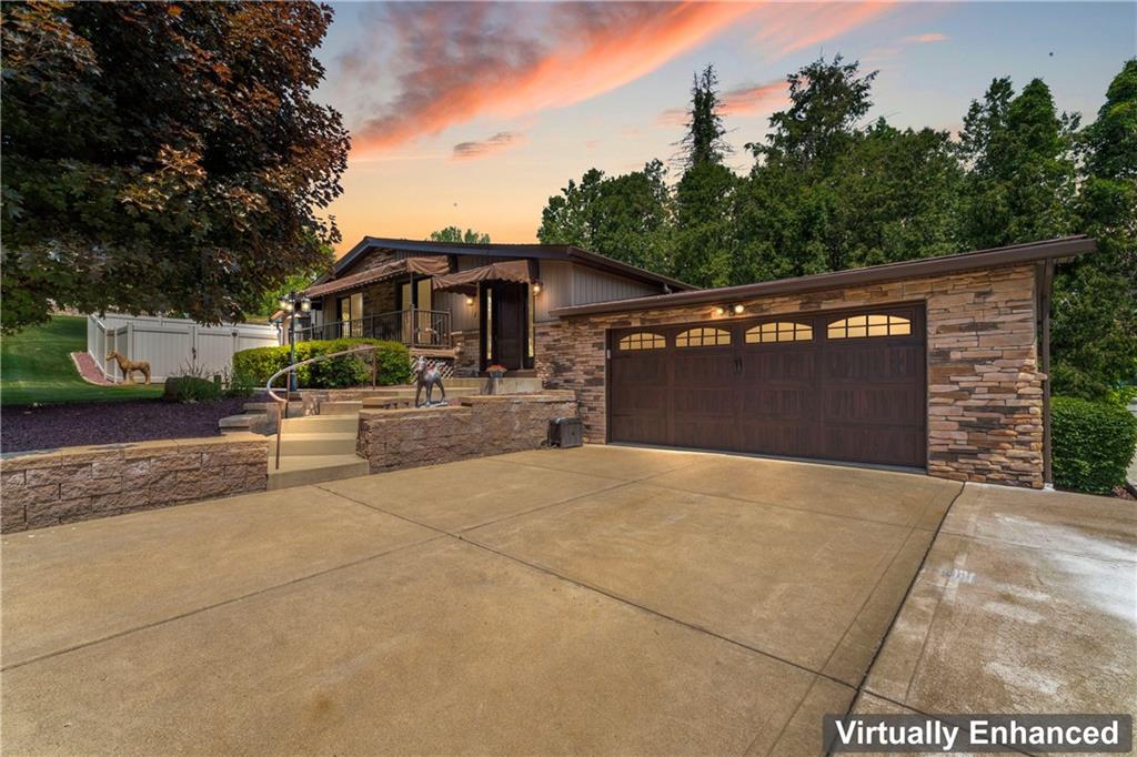 19 Ellen Drive McKees Rocks, PA 15136 - Photo 37 of 38 a front view of a house with a yard and garage