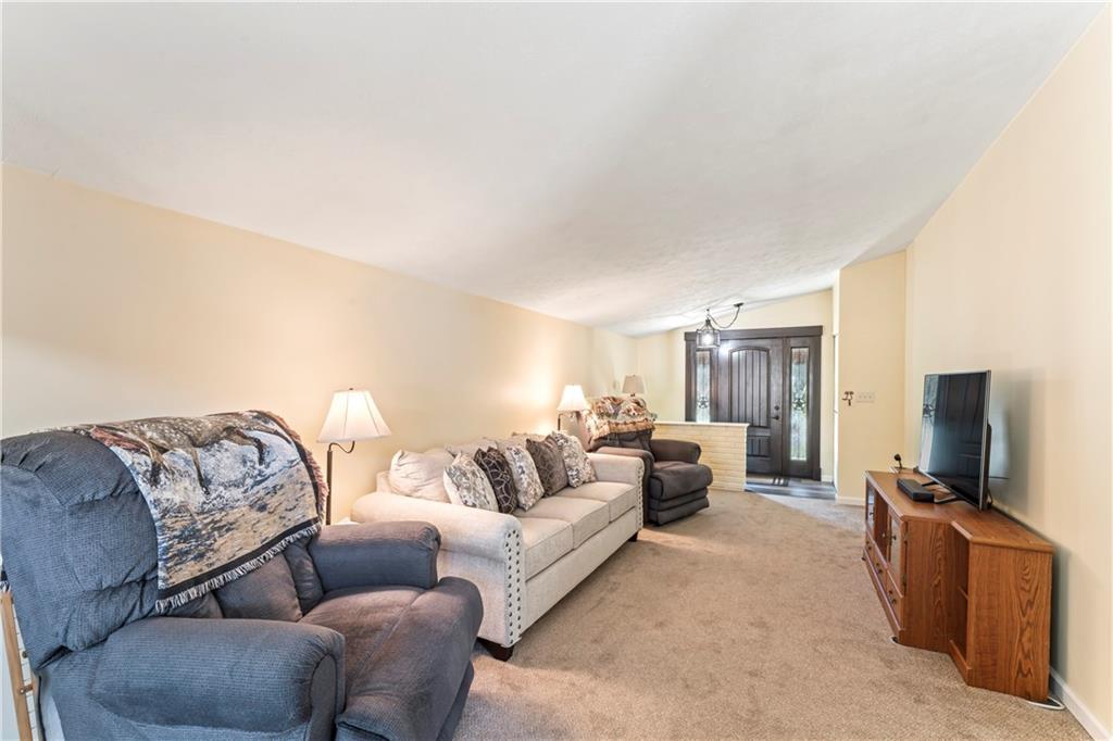 19 Ellen Drive McKees Rocks, PA 15136 - Photo 4 of 38 a living room with furniture and a flat screen tv