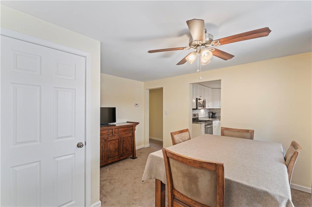 19 Ellen Drive McKees Rocks, PA 15136 - Photo 5 of 38 a view of a dining room with furniture and a chandelier fan