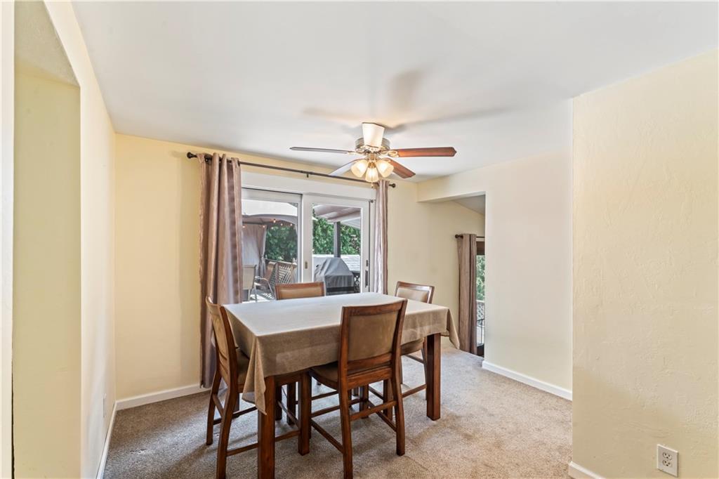 19 Ellen Drive McKees Rocks, PA 15136 - Photo 6 of 38 a dining room with furniture a chandelier and a rug