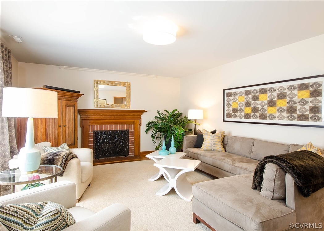 5013 Devonshire Road Richmond, VA 23225 - Photo 3 of 20 The living room is spacious with custom carpet ove