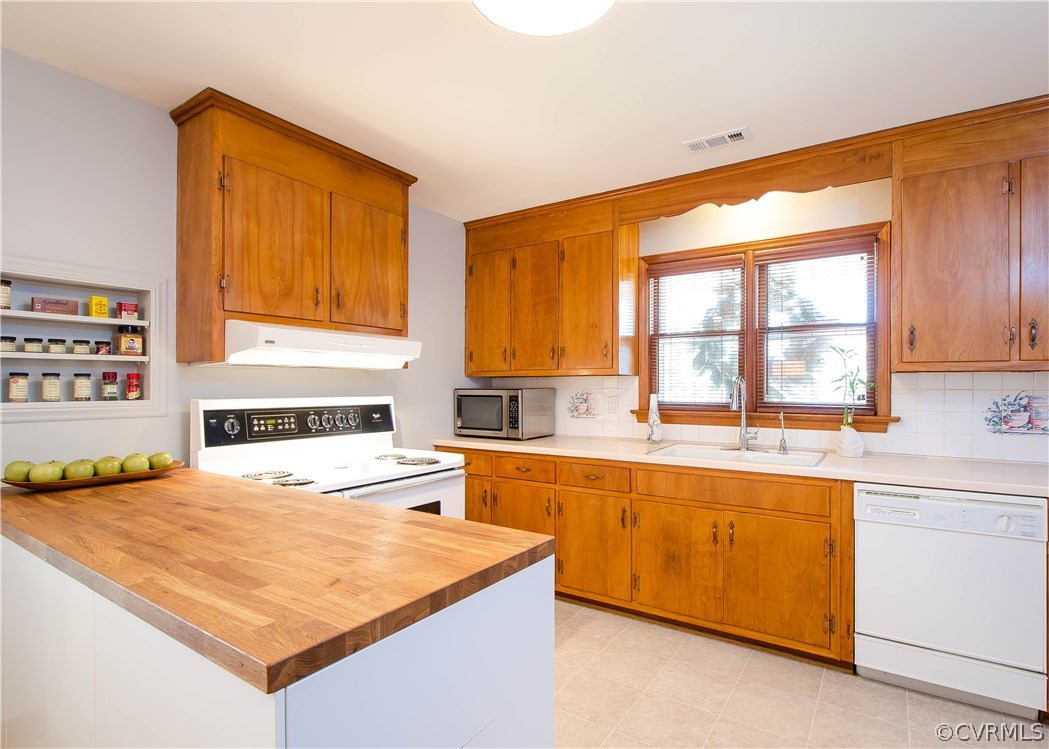 5013 Devonshire Road Richmond, VA 23225 - Photo 5 of 20 The kitchen is open and bright with new vinyl floo