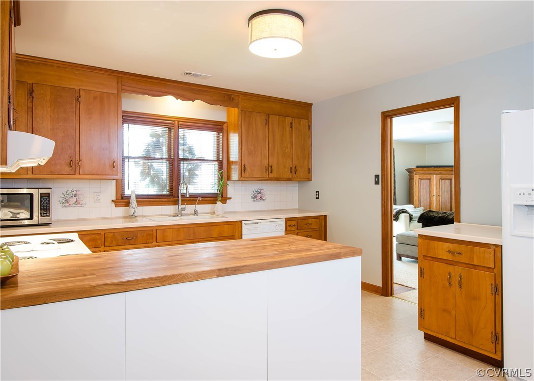 5013 Devonshire Road Richmond, VA 23225 - Photo 6 of 20 This view of the kitchen shows the doorway from th