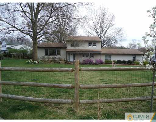 1 Perry Road East Brunswick, NJ 08816 - Photo 2 of 18 a front view of a house with a garden