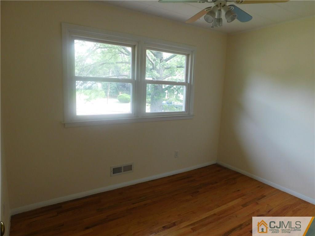 1 Perry Road East Brunswick, NJ 08816 - Photo 13 of 18 an empty room with a window