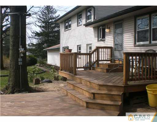 1 Perry Road East Brunswick, NJ 08816 - Photo 16 of 18 a backyard of a house with garden and patio