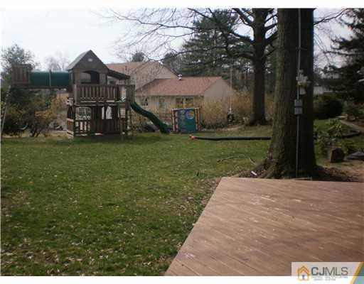 1 Perry Road East Brunswick, NJ 08816 - Photo 17 of 18 a front view of a house with garden