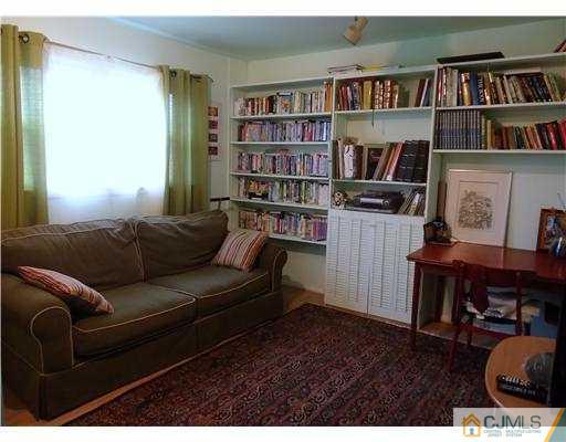 1 Perry Road East Brunswick, NJ 08816 - Photo 5 of 18 a living room with furniture and a book shelf