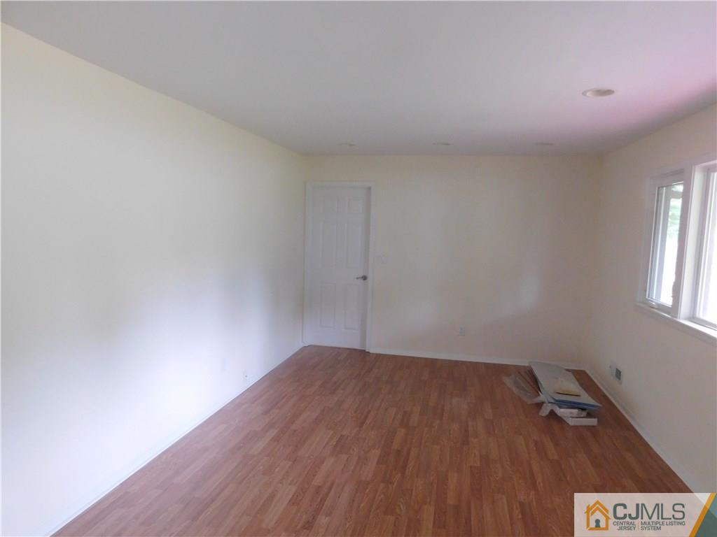 1 Perry Road East Brunswick, NJ 08816 - Photo 7 of 18 a view of a room with wooden floor and window