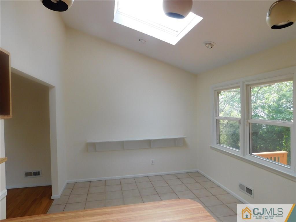 1 Perry Road East Brunswick, NJ 08816 - Photo 9 of 18 a view of an empty room with a window