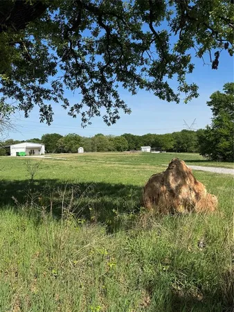 a view of a lake with a big yard