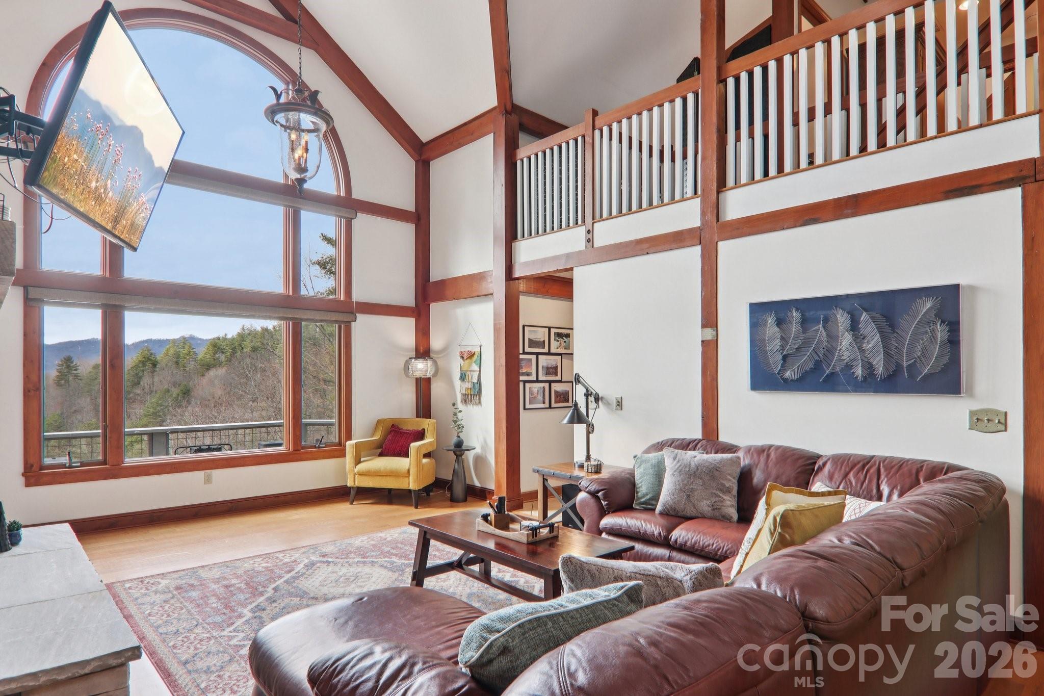 28 Nantahala Ridge Bryson City, NC 28713 - Photo 12 of 47 a living room with furniture and a large window with outer view