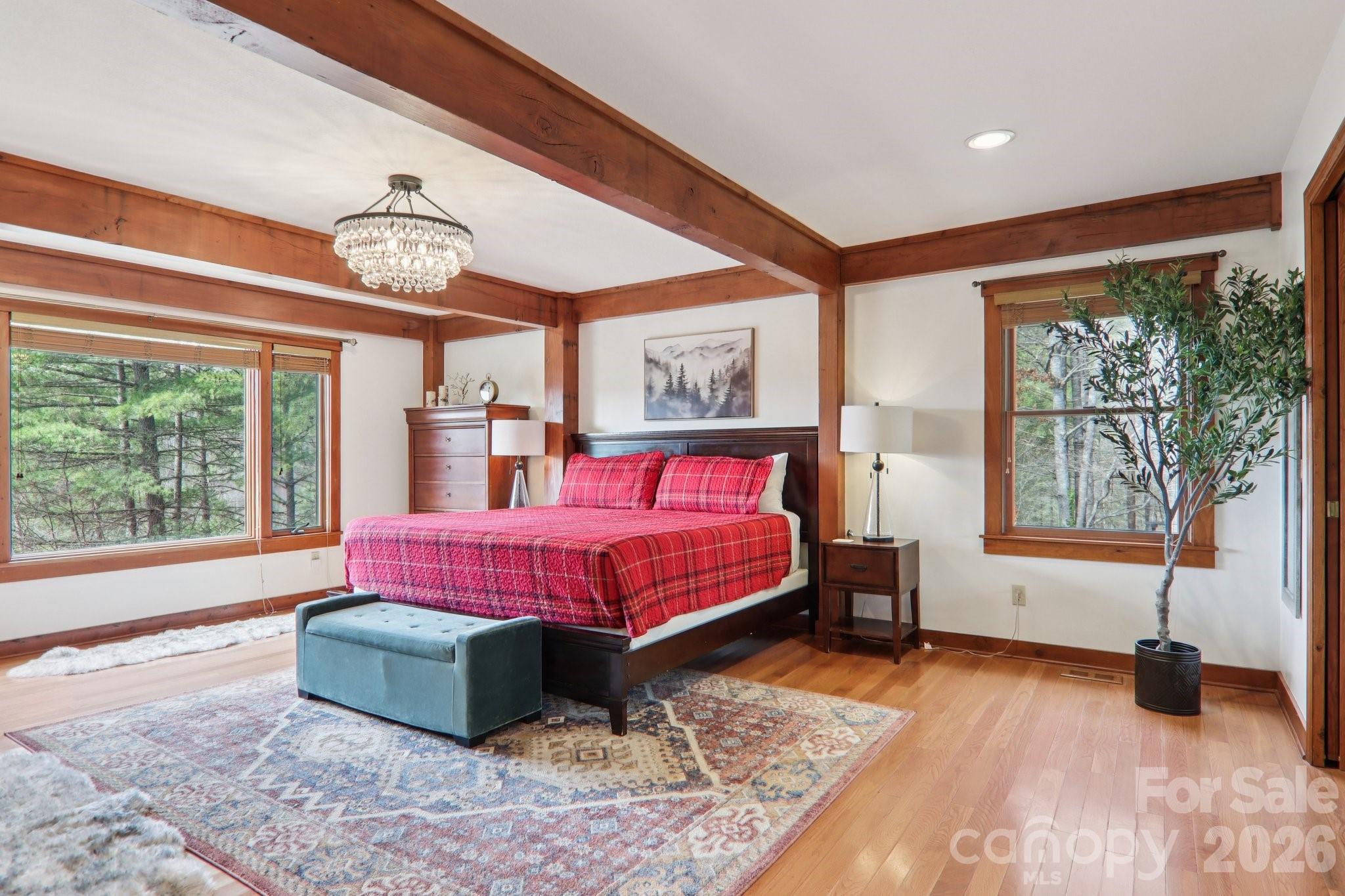28 Nantahala Ridge Bryson City, NC 28713 - Photo 24 of 47 a spacious bedroom with a bed and wooden floor