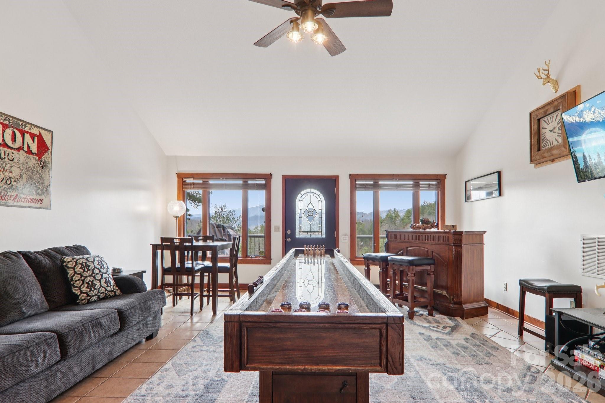28 Nantahala Ridge Bryson City, NC 28713 - Photo 30 of 47 a living room with furniture and a chandelier