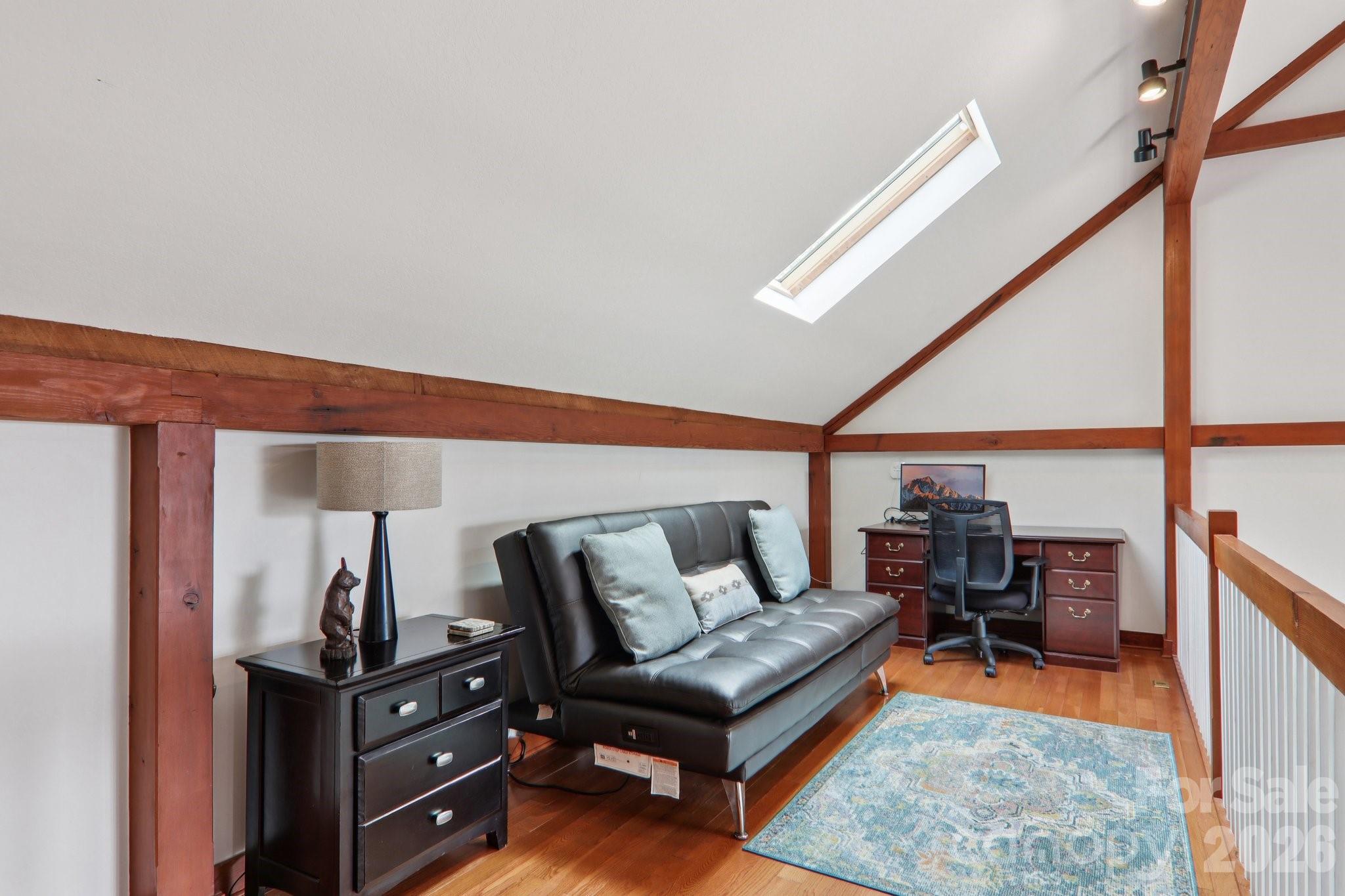 28 Nantahala Ridge Bryson City, NC 28713 - Photo 32 of 47 a living room with furniture a rug and a window