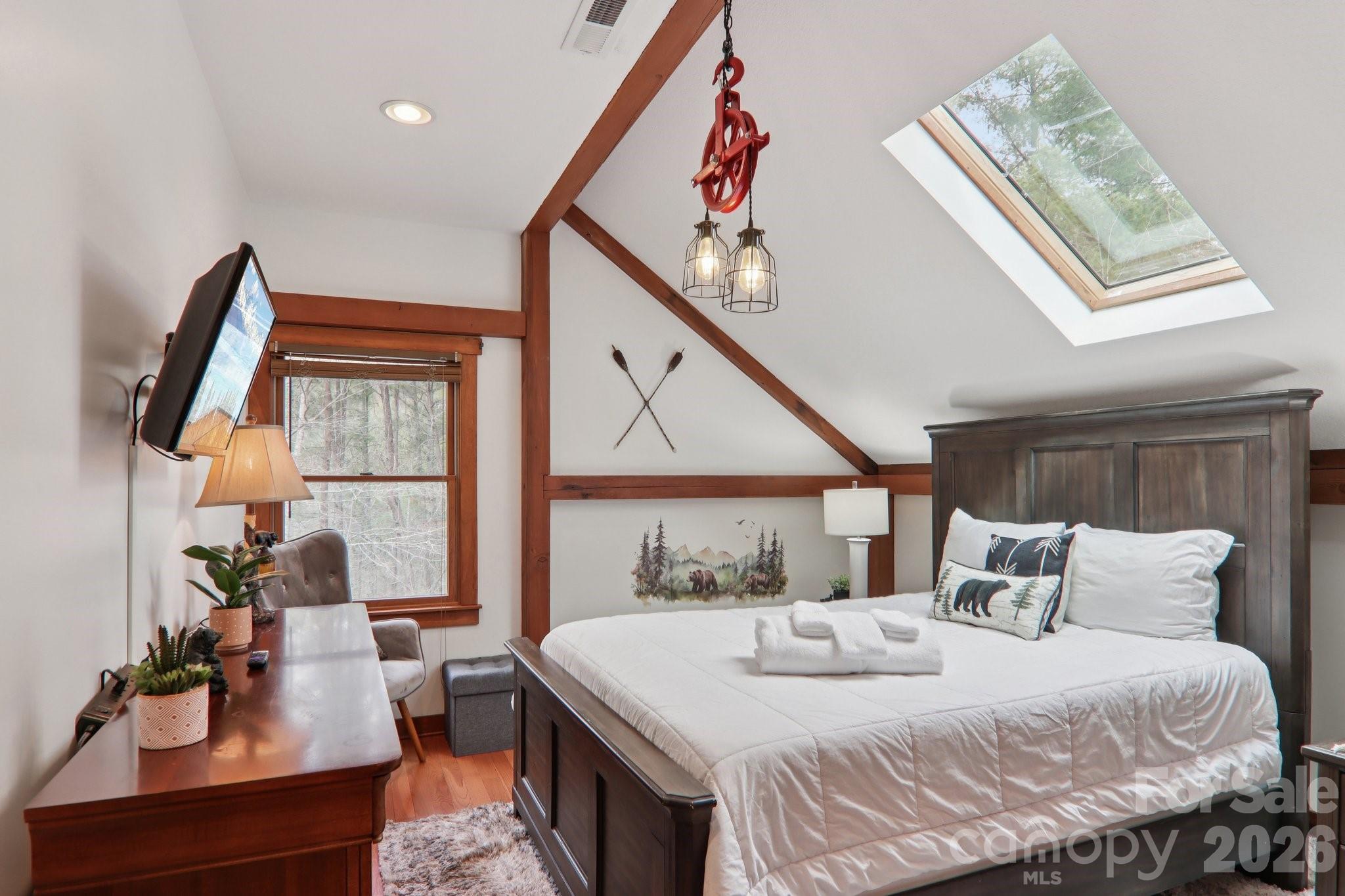 28 Nantahala Ridge Bryson City, NC 28713 - Photo 34 of 47 a bedroom with a large bed and a window