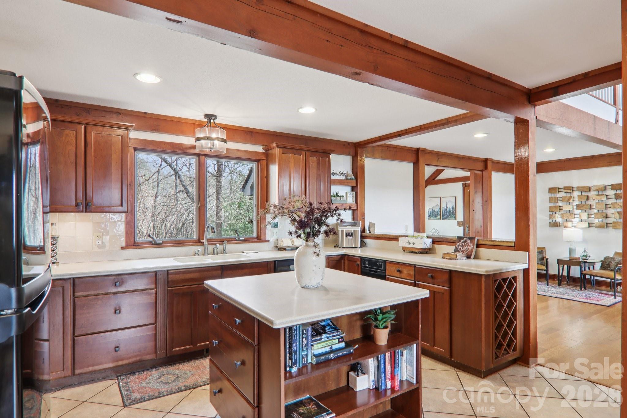 28 Nantahala Ridge Bryson City, NC 28713 - Photo 4 of 47 a kitchen with a stove a refrigerator and a view of living room