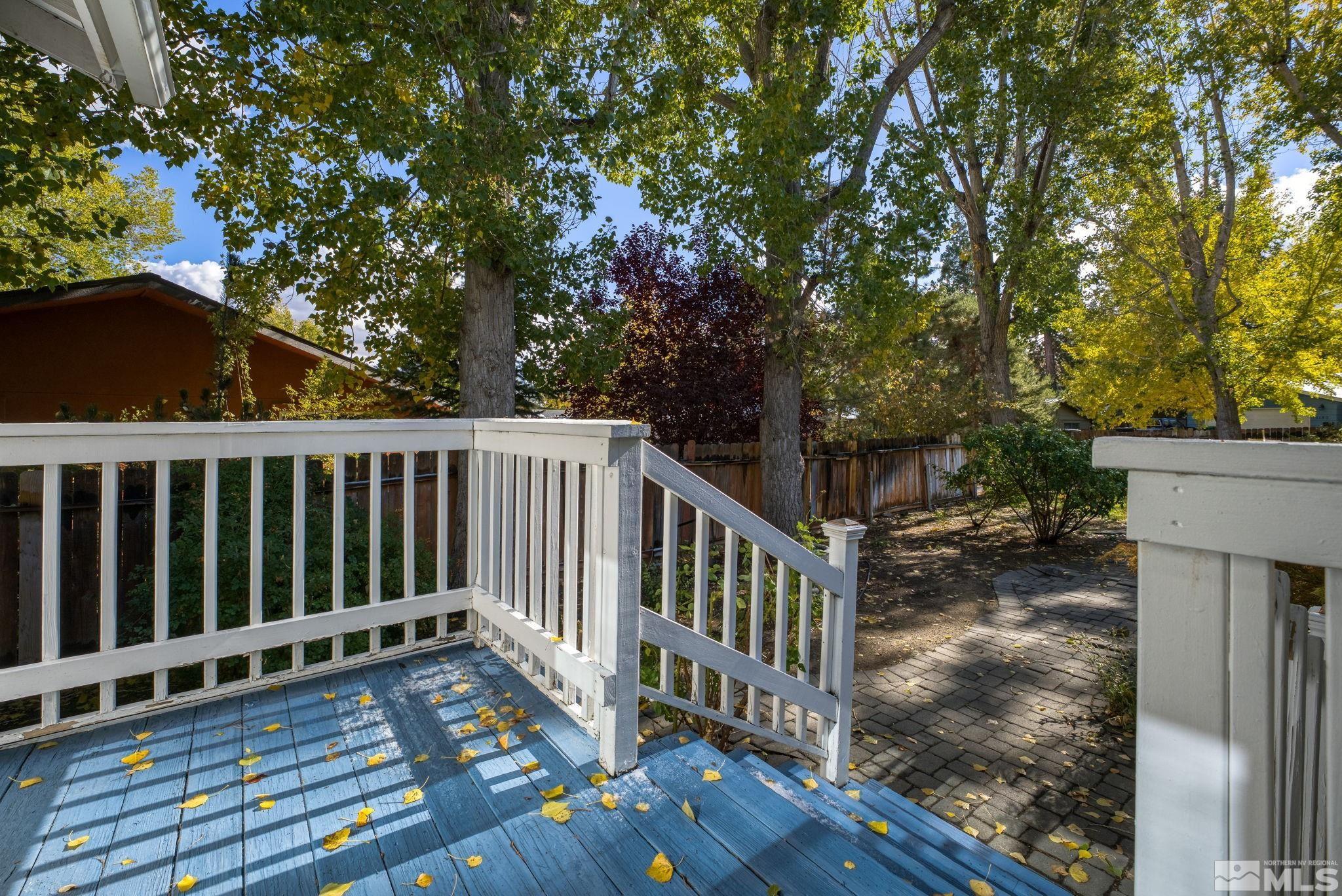 1990 Fallen Leaf Court Reno, NV 89509 - Photo 15 of 32 a view of a deck with wooden floor and fence