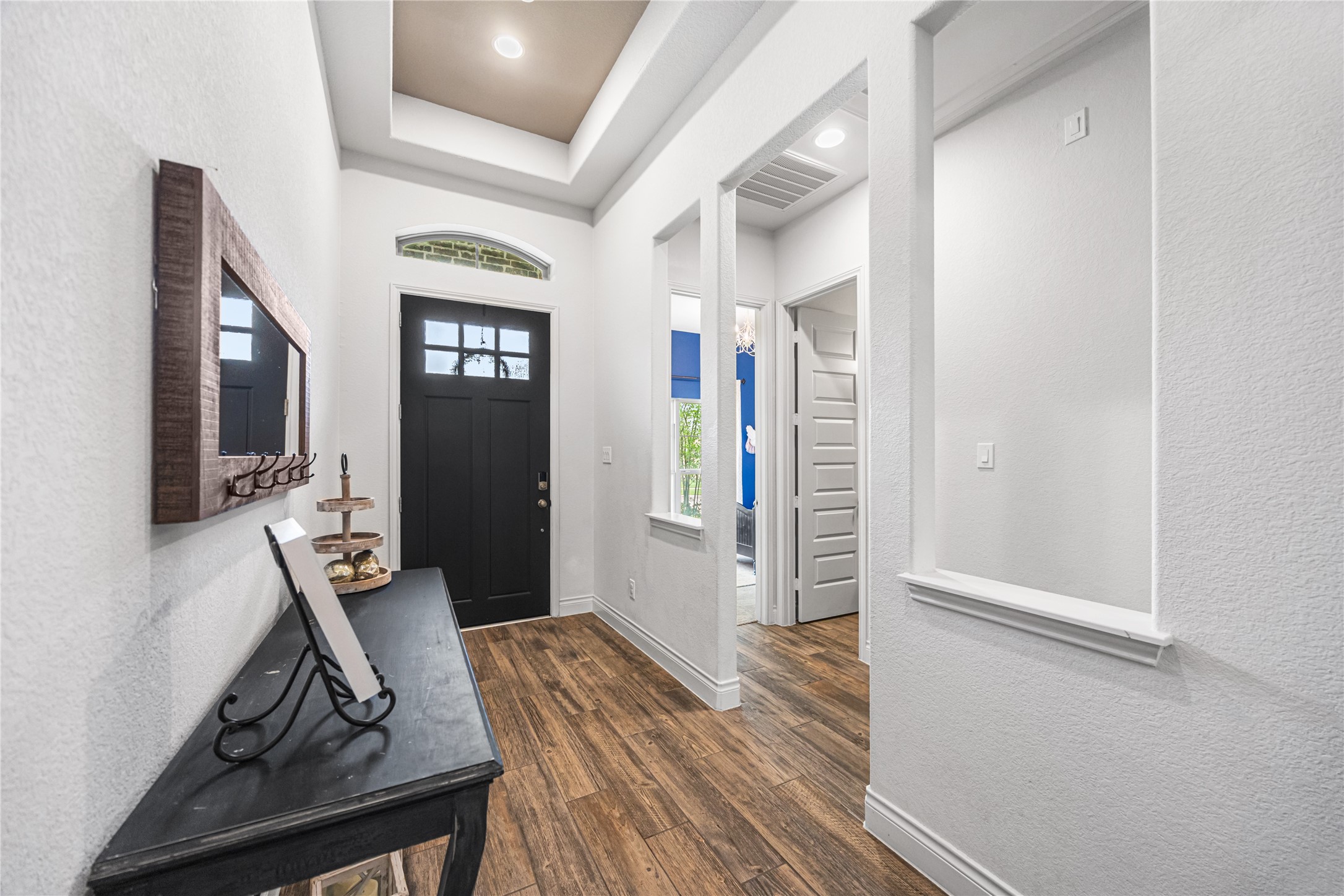 28169 Knight Peak Drive Spring, TX 77386 - Photo 5 of 33 a view of a hallway to a livingroom with furniture