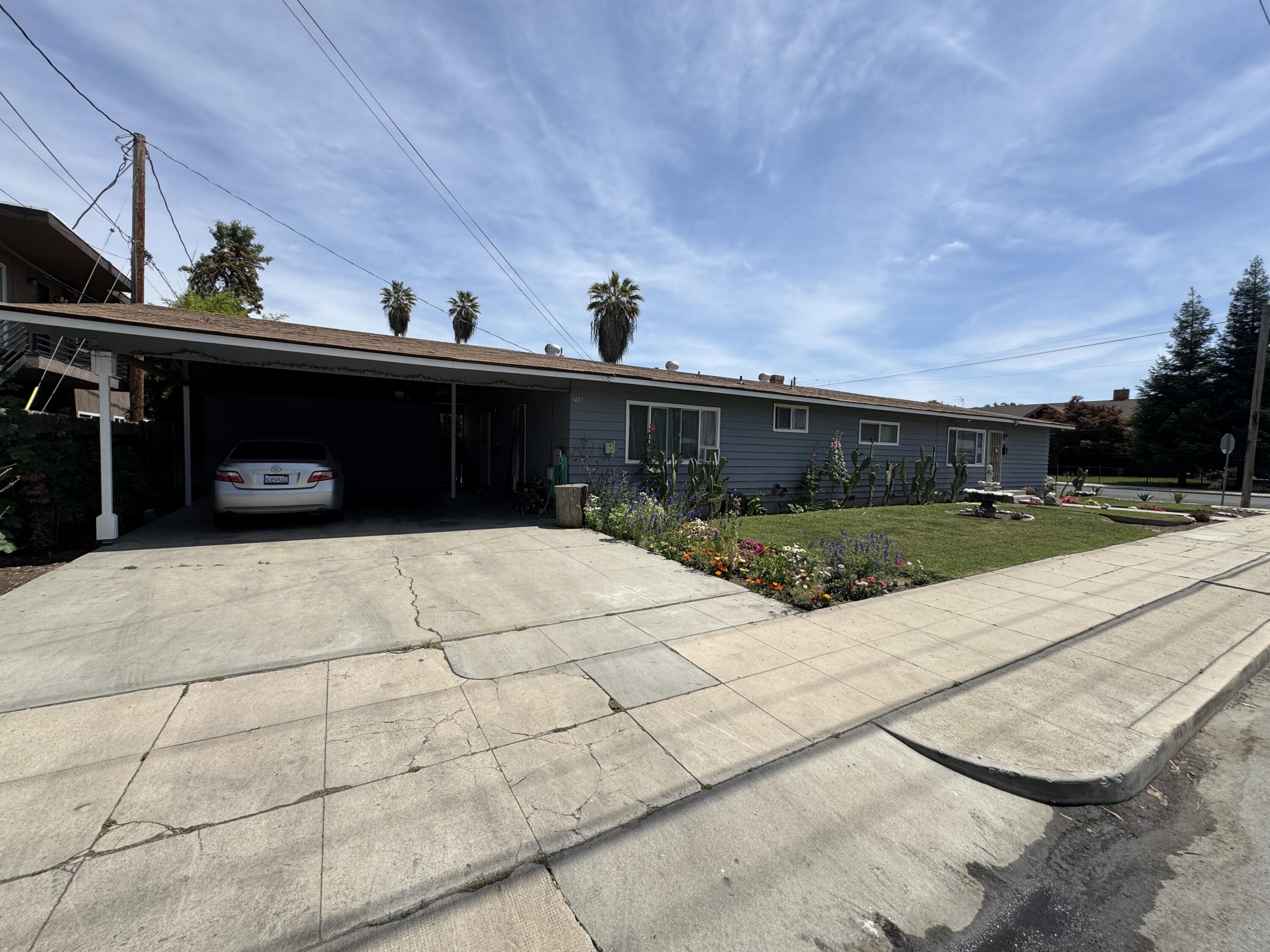 704 North Floral Street Visalia, CA 93291 - Photo 5 of 51 a front view of a house with yard