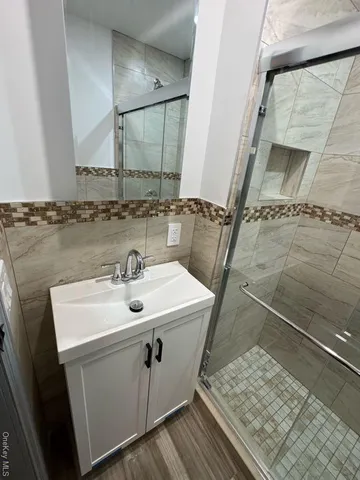 a bathroom with a sink and mirror