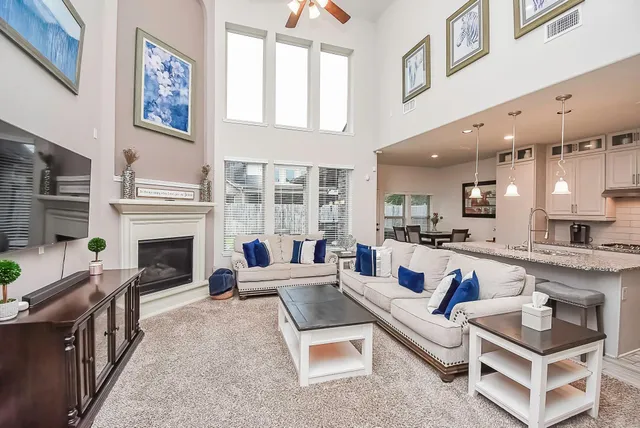 a living room with fireplace furniture and a fireplace