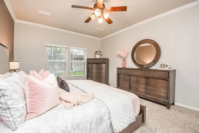 a bedroom with a bed and a dresser