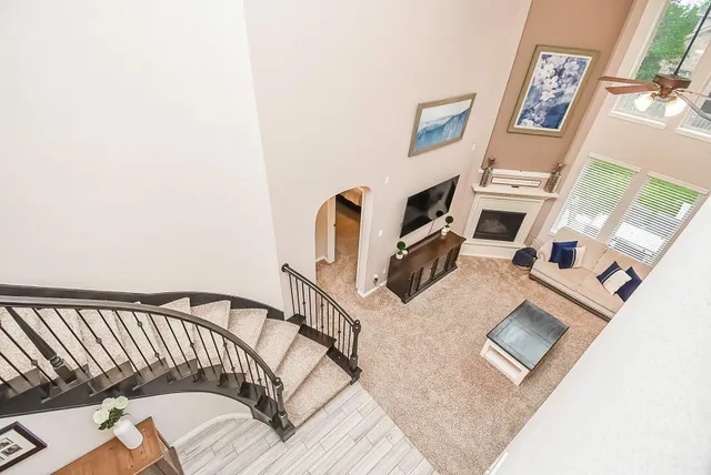 a view of a livingroom with furniture and a fireplace
