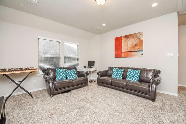 a living room with furniture and a window