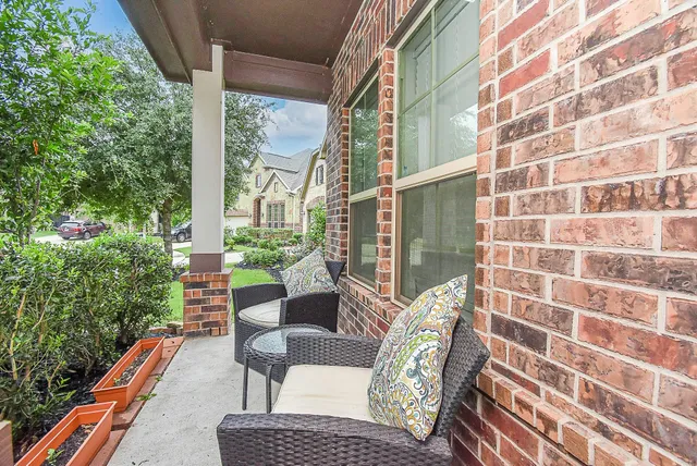 a view of balcony with wooden floor and outdoor seating