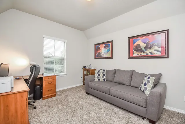 a living room with furniture and a window