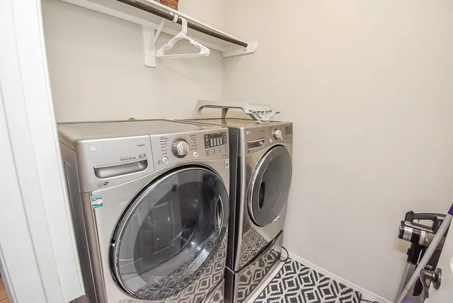 a view of a patio with a table chairs and a yard