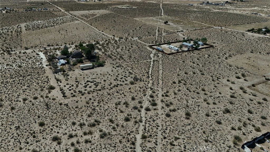 9821 Ivanhoe Road Lucerne Valley, CA 92356 - Photo 11 of 12 Red boundary lines on pictures are an estimate and for marketing purposes only. Buyer to verify all aspects of this property including, but not limited to utilities, assessments, boundaries, usage, access, and zoning to satisfy themselves.