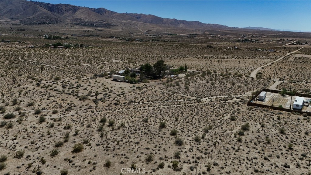 9821 Ivanhoe Road Lucerne Valley, CA 92356 - Photo 12 of 12 Red boundary lines on pictures are an estimate and for marketing purposes only. Buyer to verify all aspects of this property including, but not limited to utilities, assessments, boundaries, usage, access, and zoning to satisfy themselves.