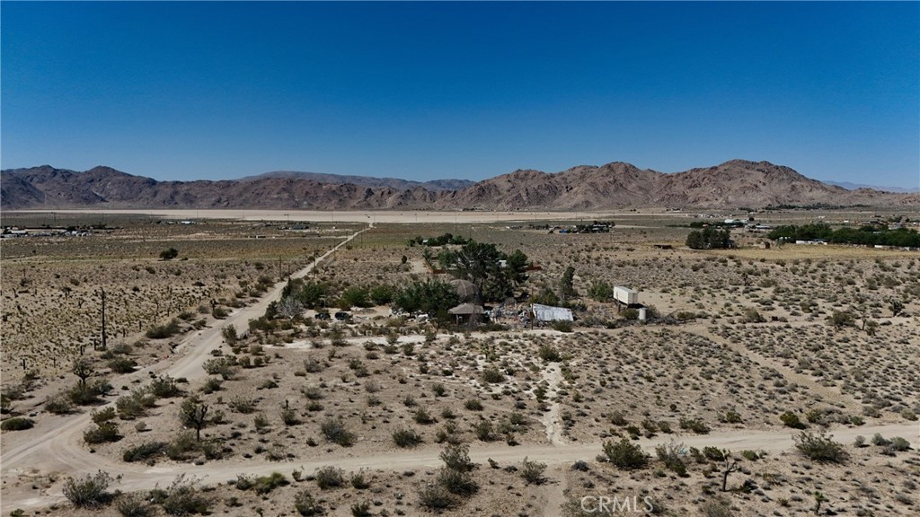 9821 Ivanhoe Road Lucerne Valley, CA 92356 - Photo 2 of 12 Red boundary lines on pictures are an estimate and for marketing purposes only. Buyer to verify all aspects of this property including, but not limited to utilities, assessments, boundaries, usage, access, and zoning to satisfy themselves.