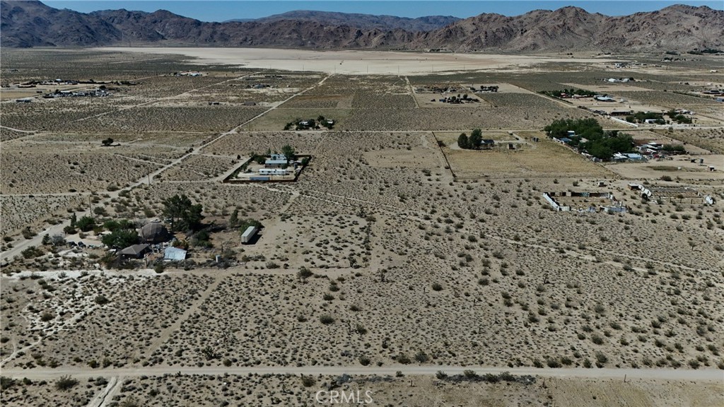 9821 Ivanhoe Road Lucerne Valley, CA 92356 - Photo 3 of 12 Red boundary lines on pictures are an estimate and for marketing purposes only. Buyer to verify all aspects of this property including, but not limited to utilities, assessments, boundaries, usage, access, and zoning to satisfy themselves.