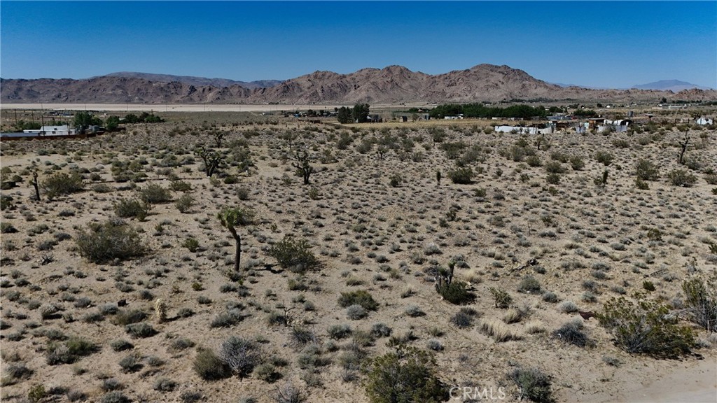 9821 Ivanhoe Road Lucerne Valley, CA 92356 - Photo 4 of 12 Red boundary lines on pictures are an estimate and for marketing purposes only. Buyer to verify all aspects of this property including, but not limited to utilities, assessments, boundaries, usage, access, and zoning to satisfy themselves.