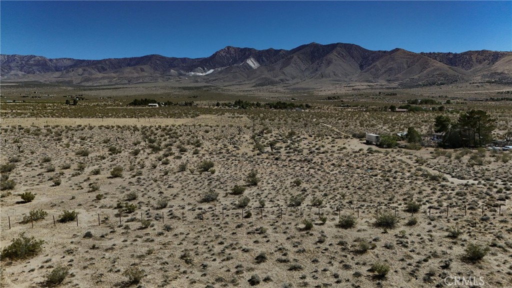 9821 Ivanhoe Road Lucerne Valley, CA 92356 - Photo 5 of 12 Red boundary lines on pictures are an estimate and for marketing purposes only. Buyer to verify all aspects of this property including, but not limited to utilities, assessments, boundaries, usage, access, and zoning to satisfy themselves.