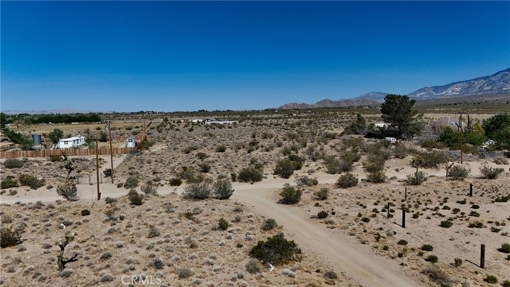 9821 Ivanhoe Road Lucerne Valley, CA 92356 - Photo 6 of 12 Red boundary lines on pictures are an estimate and for marketing purposes only. Buyer to verify all aspects of this property including, but not limited to utilities, assessments, boundaries, usage, access, and zoning to satisfy themselves.