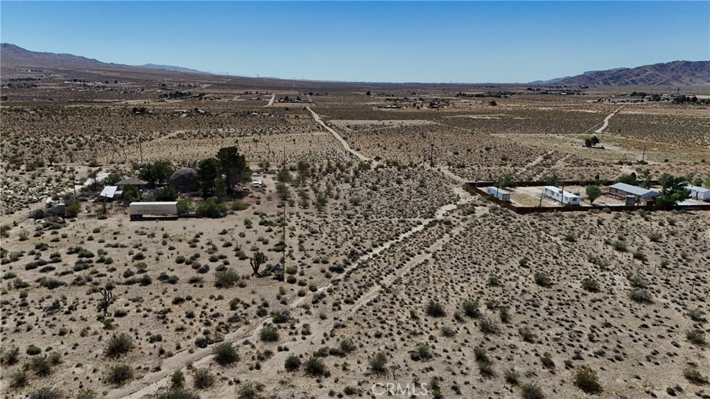 9821 Ivanhoe Road Lucerne Valley, CA 92356 - Photo 7 of 12 Red boundary lines on pictures are an estimate and for marketing purposes only. Buyer to verify all aspects of this property including, but not limited to utilities, assessments, boundaries, usage, access, and zoning to satisfy themselves.