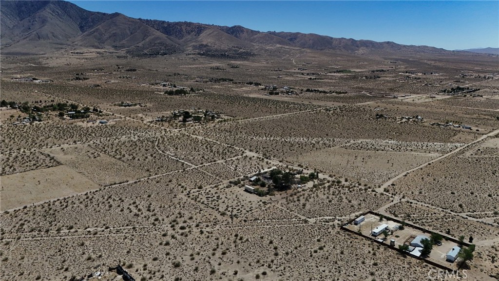 9821 Ivanhoe Road Lucerne Valley, CA 92356 - Photo 8 of 12 Red boundary lines on pictures are an estimate and for marketing purposes only. Buyer to verify all aspects of this property including, but not limited to utilities, assessments, boundaries, usage, access, and zoning to satisfy themselves.