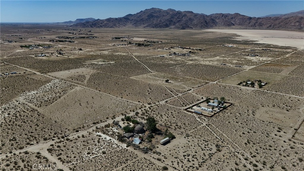 9821 Ivanhoe Road Lucerne Valley, CA 92356 - Photo 9 of 12 Red boundary lines on pictures are an estimate and for marketing purposes only. Buyer to verify all aspects of this property including, but not limited to utilities, assessments, boundaries, usage, access, and zoning to satisfy themselves.
