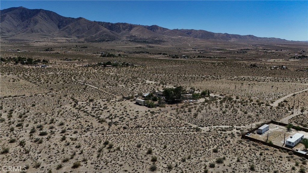 9821 Ivanhoe Road Lucerne Valley, CA 92356 - Photo 10 of 12 Red boundary lines on pictures are an estimate and for marketing purposes only. Buyer to verify all aspects of this property including, but not limited to utilities, assessments, boundaries, usage, access, and zoning to satisfy themselves.