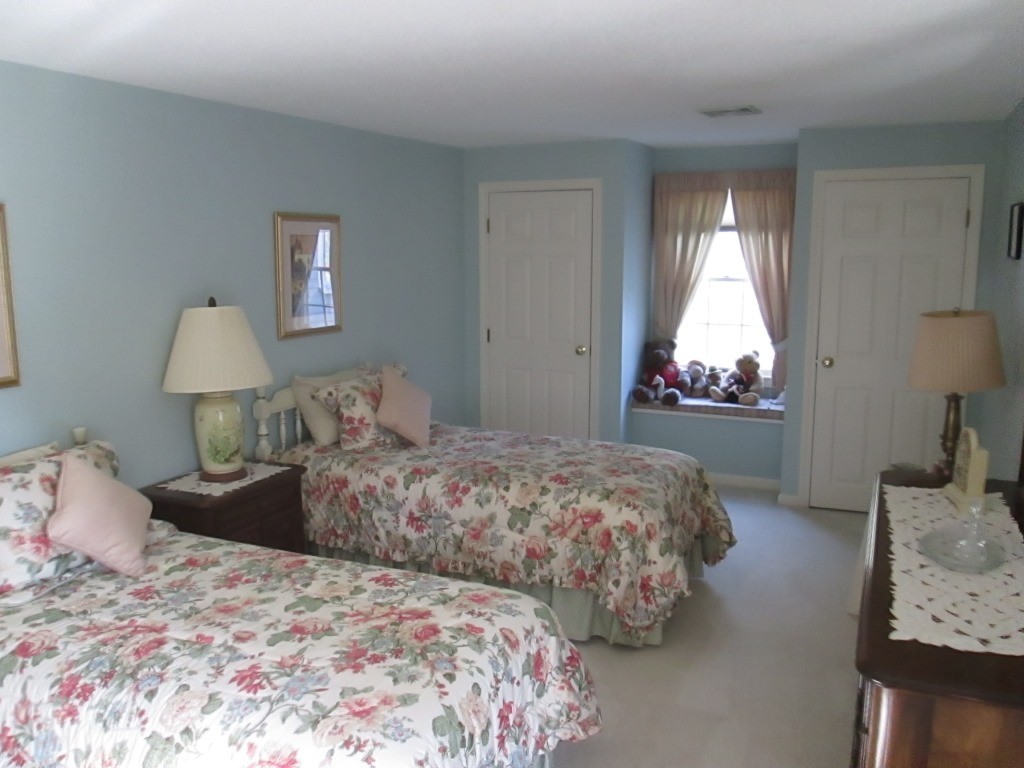 6 Holly Gate Circle, Unit 6 Middleton, MA 01949 - Photo 15 of 23 a bedroom with bed and window