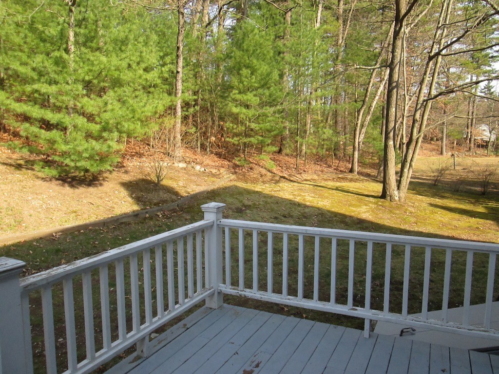 6 Holly Gate Circle, Unit 6 Middleton, MA 01949 - Photo 20 of 23 a view of a wooden fence