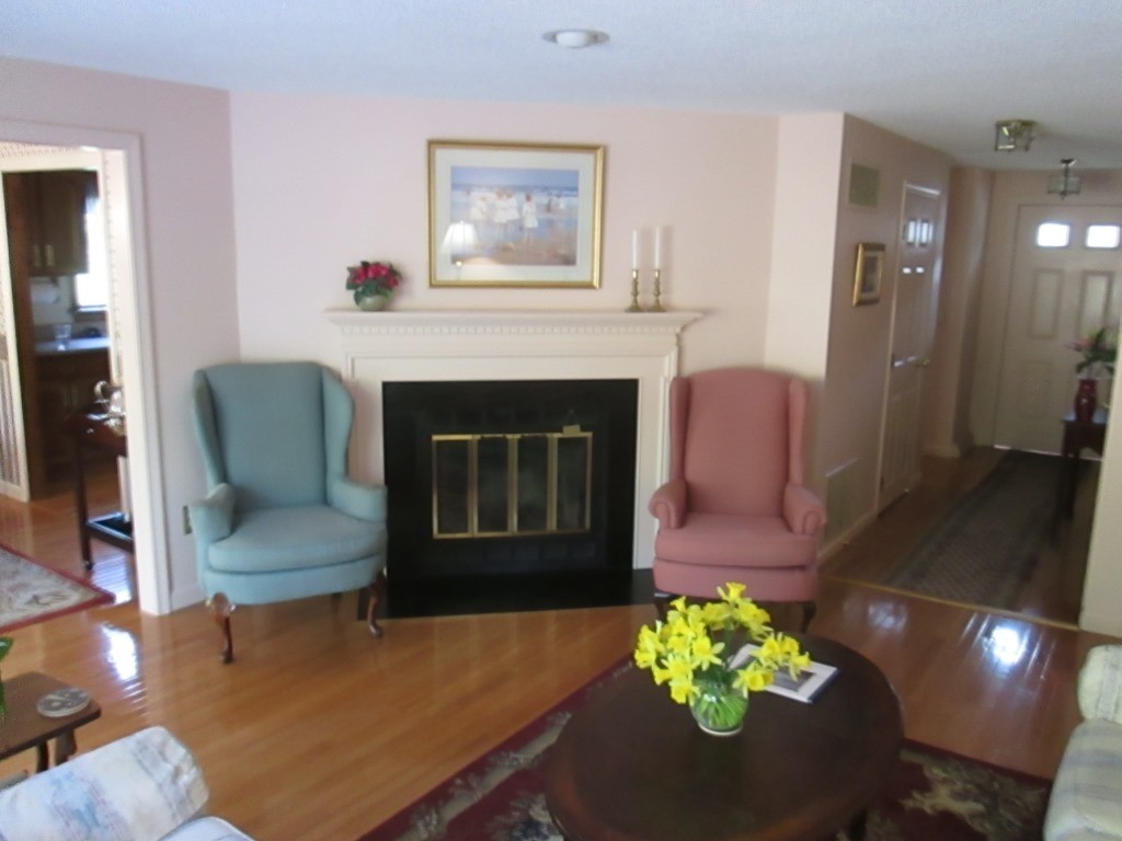 6 Holly Gate Circle, Unit 6 Middleton, MA 01949 - Photo 6 of 23 a living room with furniture and a fireplace