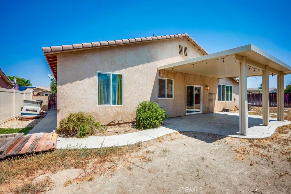 33409 Mesolite Way Menifee, CA 92584 - Photo 17 of 18 a front view of a house with a yard outdoor seating space